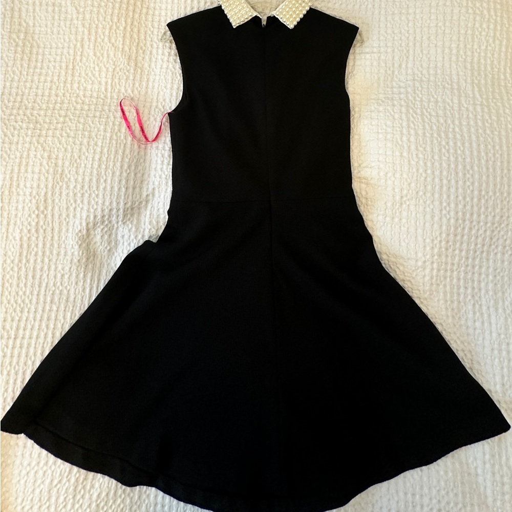 Designed black dress either pearls